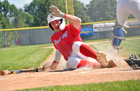Pinnacle Bank Post 42 Seniors center fielder Keegan Chaney slides into home for a run during Aurora’s 13-3 loss to Gering Thursday. 