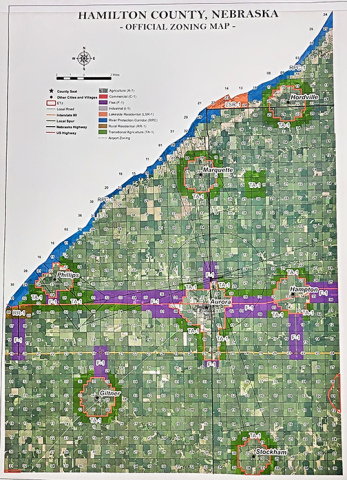 This photo of the large official county zoning map hanging in the Planning and Zoning office at the courthouse shows the various zoning districts in the county established by the 2019 Comprehensive Plan. The highest percentage of the land in the county is A-1 Agricultural Preservation District while the section marked F-1 along Highway 34 and part of Highway 14 is known as the Flex District.  