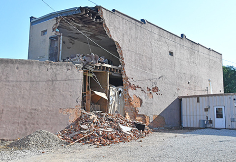 This photo of the former Gambles building was taken Saturday evening, shortly after a portion of the second story wall was captured on video falling to the ground.