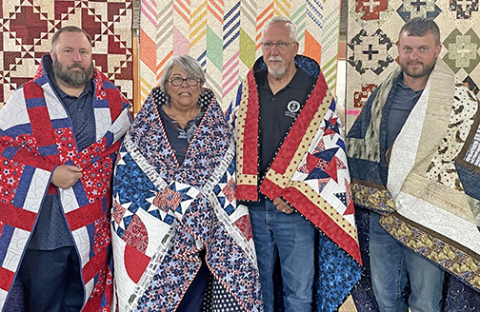 These veterans were honored by being presented with Quilts of Valor to recognize their service. From left to right: Matthew Vetter, Denise Winton, Ed Winton and Brad Dietz.