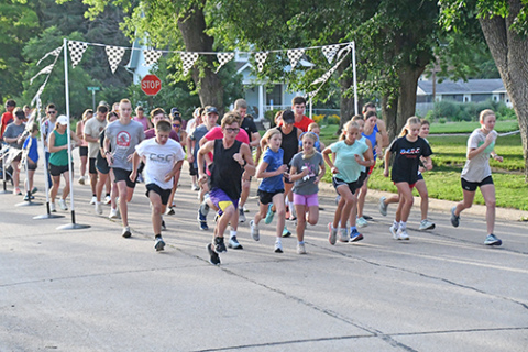 The field is off at running at the start of a 5K race on Saturday.