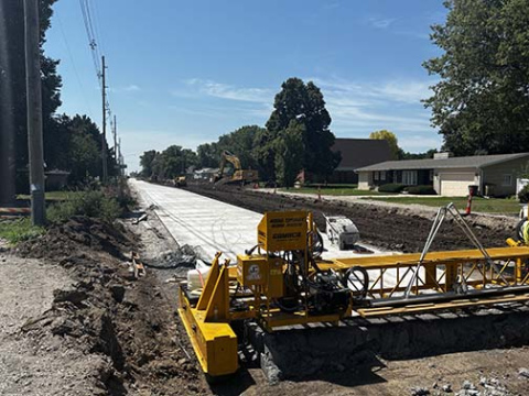 This north to south view of 1st Street taken Monday morning shows that half of the street has been poured from just beyond Park Lane all the way to the railroad tracks. Crews plan to begin pouring the other half this week, with hopes of having the street accessible in the school area by the time school bells are scheduled to ring Aug. 14-15.