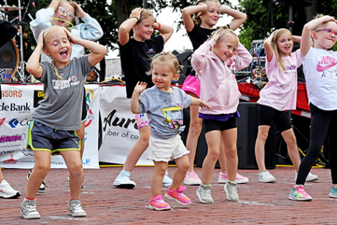 Kids dance to the music at one of the 2024 Bands on the Bricks Fridays.