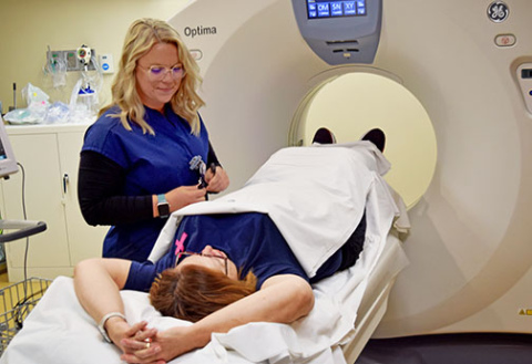 Jessica Prothman, MCHI radiologic technologist, demonstrates the coronary calcium CT testing now offered at Memorial Hospital.