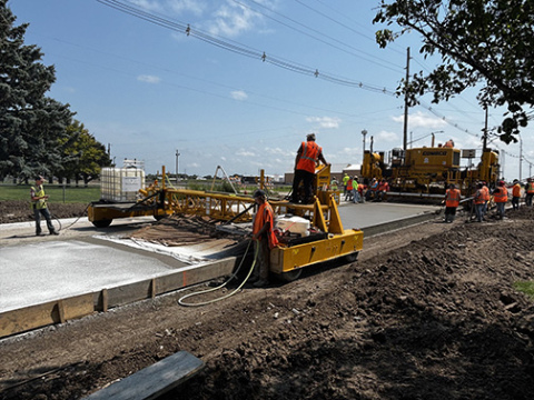 Crews finished pouring the west lane of 1st Street near the school Aug. 5, beginning a curing process which will be tested this week to determine when the road is ready for traffic.