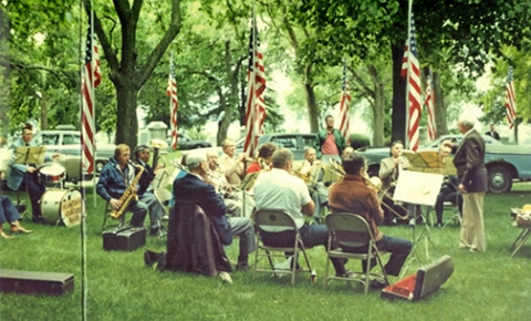 The Hamilton County Community Band, under the direction of Sam Ross (right) performs at the Aurora Cemetery on Memorial Day, May 27, 1986. Ross had been instrumental in the formation of the Centennial Band for Aurora’s 100th birthday celebration in 1971. The band was later renamed the Hamilton County Community Band. This would be Ross’s final performance with the band, as he died of a heart attack at the same event shortly after the photo was taken.  (Photo courtesy of Plainsman Museum)