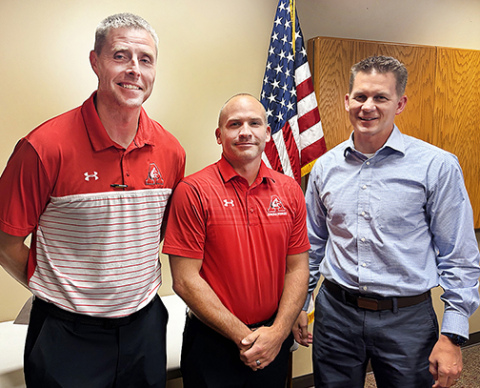 Pictured from left during a brief awards ceremony Aug. 11 are Jay Staehr, Cody Hoegh and Chad Carlson. Staehr received the Lifesaver Award from Emergency Health Systems of Nebraska for his quick action, which was credited for saving Hoegh’s life during a Feb. 5 heart attack at the school. Staehr and Carlson were also recognized by the Nebraska State Association of Athletic Trainers for their heroic actions.