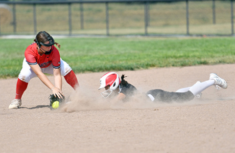 Aurora’s Emely Gonzalez gets dirty with a safe slide into second base during the Huskies’ 8-2 loss to Auburn in Friday’s tournament. Gonzalez collected four hits and two RBIs through Aurora’s first four games. 