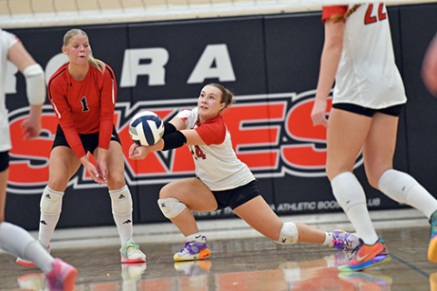 Aurora’s Paityn Wyatt receives a York serve during the Huskies’ five-set victory over the Dukes Thursday. Wyatt tallied 14 digs in the win for the Huskies. 