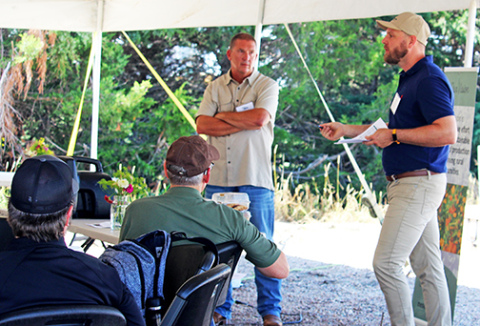 Dr. Jason Ackerson (right) of the Soil Health Institute speaks on the profitability of adopting soil health practices at the recent Nebraska Soil Health Coalition Celebration of Learning near Bladen. Standing next to him is Grand Island area farmer Zach Mader, who has transitioned to a soil health management system over the past several years. 
