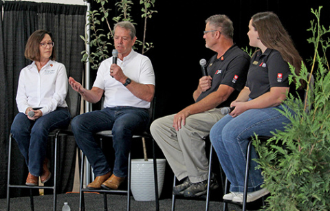 Gov. Jim Pillen speaks on Wednesday at Husker Harvest Days about his recent trade mission to Japan, the future of ag careers in Nebraska and his legislative priorities for next year. Pictured from left are State Ag Director Sherry Vinton, Pillen, Nebraska Farmer Senior Editor Curt Arens and staff writer Elizabeth Hodges. 