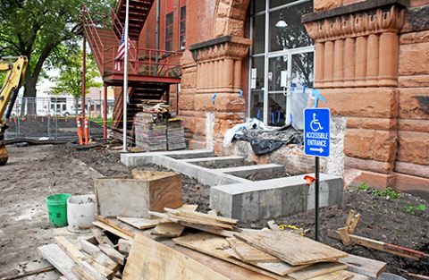 The concrete footings have been poured for the new eastside steps of the courthouse. This week workers plan to begin installing the bricks and granite blocks to build the steps. 