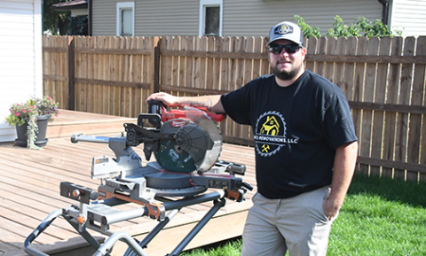 Heath Enderle Jr., who launched Eight-3 Renovations, LLC in June, displays  a deck in his own back yard as a sample of the type of home improvement projects he now offers.
