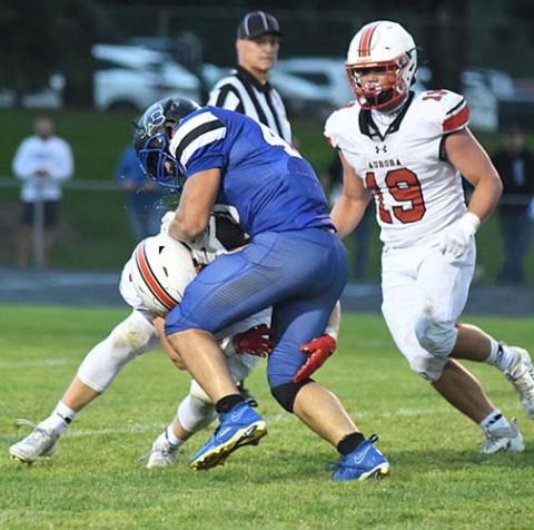 Garrett Kuehner goes low to bring down Pierce runningback Kaiden Fritz as teammate Collin Stolpe comes in to assist.