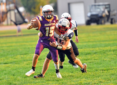 Landen Rojewski wiggles out of a tackle during Hampton’s 43-14 win over Parkview Christian Friday. Rojewski scored in all three ways Friday -- passing, rushing and receiving. 