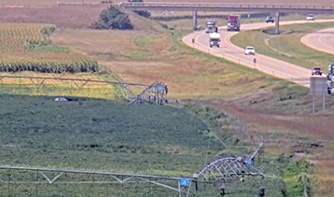 This image of the scene of an Aug. 26 fatal rollover crash on I-80 near Aurora was captured by a Nebraska 511 interstate traffic camera. The car can be seen on the left side of the photo beneath the irrigation pivot where it came to rest after leaving the roadway and rolling numerous times. 