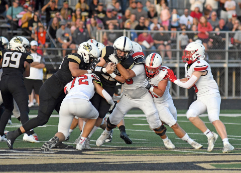 Aurora's defense makes the stop and helped the Huskies to a fifth straight win over Northwest Friday. 