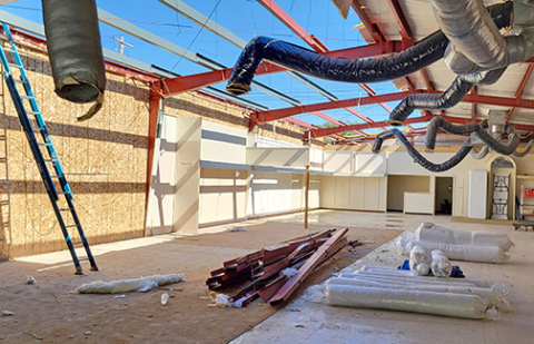 Work continues on residing and reroofing the Cornwell Building on the square