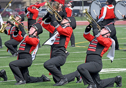 The Aurora Marching Huskies had another superior day at the 83rd annual Harvest of Harmony parade and field competitions. In addition to its Best Class A/B and first place Class B trophies, the band was the only Class B band to receive a Division I in the field competition. Performing in the field competition are trumpet players, from left: Ellie Brown, Ryan Benger and Ashlyn Yockey.