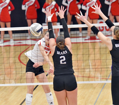Elizabeth Luebbe drops the hammer during Aurora's four-set win over Blair. 