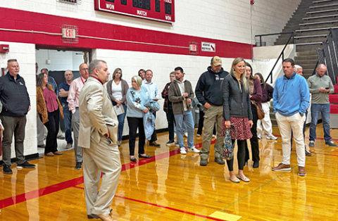 Aurora Supt. Jody Phillips leads a tour of the Aurora High School facilities Monday night during the first of several sessions planned with a newly formed community advisory committee.