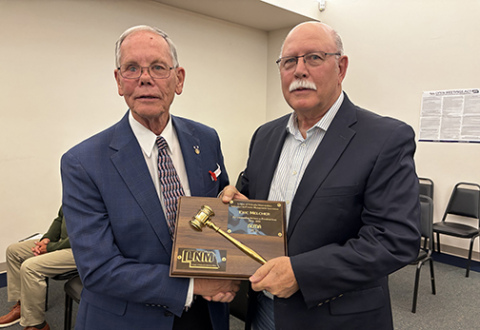 Former Aurora city administrator Rick Melcher was recognized during last week’s council meeting for his service on the League of Municipalities Nebraska City/County Managers Association, where he served the last year as president. Presenting the plaque is Mayor Marlin Seeman.
