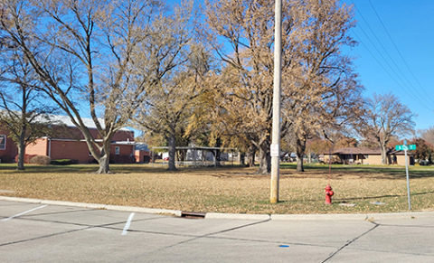 This empty space on the lot which is home to Hampton’s City Auditorium (seen at far left) is the new location for the planned veterans memorial park to be constructed in Hampton. 