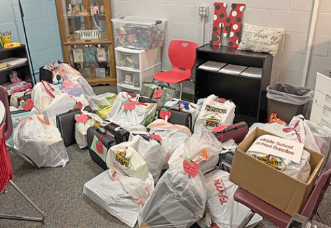 Paige McQuiston, the student and family liaison at Aurora Public Schools, focuses her time and effort on making food and various supplies available to local families in need.