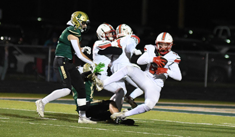 Husky senior Garrett Kuehner (8) came down with this third-quarter interception, ending a Bison threat in Aurora’s 42-21 playoff win.
