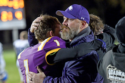 Hampton senior Porter Dose shares a moment with assistant coach Bo Kingery following the final whistle.