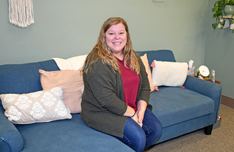 Annie De La Cruz sits in her new office space at Seeds of Change Counseling and Consulting, located at 207 S. 16th Street in Aurora.