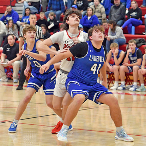 Dain Vap fights through a double team on a free throw shot during Aurora’s win over Lakeview Friday. 