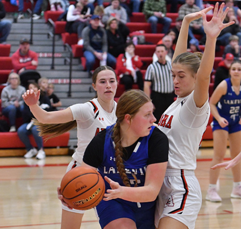 Maddie Ramaekers (right) and Hailey Hoff apply full-court pressure during early action Friday in the Lady Huskies 39-29 win over Columbus Lakeview.