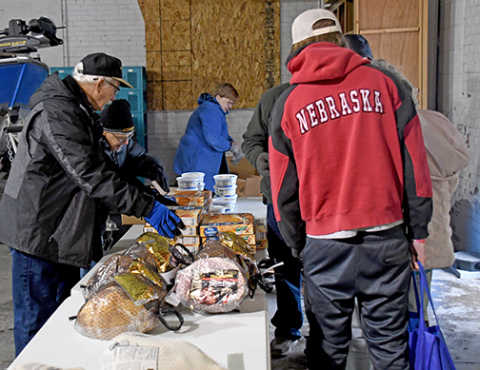 A team of Hamilton County Food Pantry volunteers spent an hour Saturday morning giving out food baskets so that 175 people could have a Christmas dinner.  