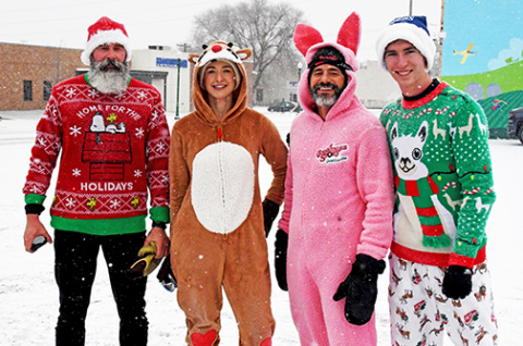 Evan Hermanson (right) was the winner of the Jingle Bell Fun Run on Saturday