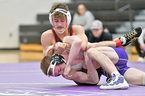 Aurora junior Logan Svoboda collected his 100th career win Friday in Platteview, adding to his currently unblemished 18-0 record this season. Svoboda is pictured above, wrestling up a weight class, defeating Minden’s Isaac Reed Thursday. 
