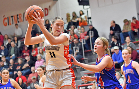 Giltner/Harvard’s Peyton Schutt (11) led the way with 20 points and eight rebounds during a 54-45 win at home over High Plains Friday. Schutt is shown here guarded by HPC’s Taya Hans. 