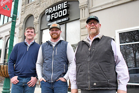 Prairie Food, a Kansas-based company focused on replenishing soil health while reducing synthetic inputs, opened a sales location earlier this month on the west side of the downtown square. Pictured from left are company representatives Pete Martin, Ben Vincent and Chris Vincent