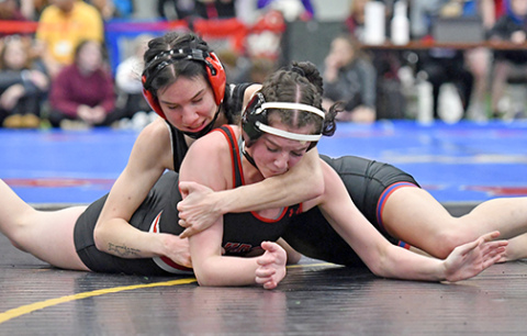 High Plains senior Dakota Gress became the first girls wrestler from the ANR coverage area to hit the 100 career win milestone Thursday during the Norm Manstedt Invite in Columbus. Gress is shown here battling Aurora’s Mia Leininger. 