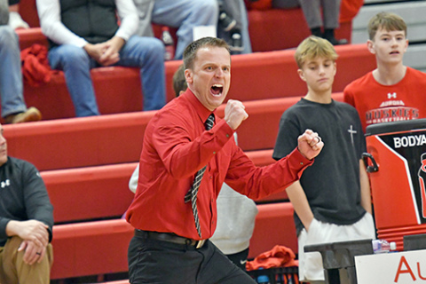 Aurora coach Scott Phillips is all fired up for his team forcing a defensive turnover in the back court during the Huskies’ 43-34 loss to Class C1 No. 1 Milford Thursday.