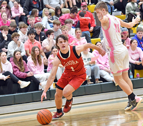 Aurora’s Canon Allen drives around the Kearney Catholic defense in a 68-30 win over the Stars. Allen was a perfect 5-for-5 in the game shooting with 14 points for the Huskies.