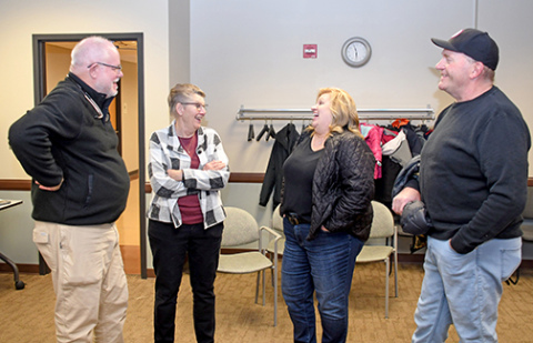 Dr. Jeff Muilenburg (left) and his wife, Cindi, share a laugh with Laurel and Rob Marlatt at a reception held at Memorial Hospital on the occasion of his retirement from medical practice. 