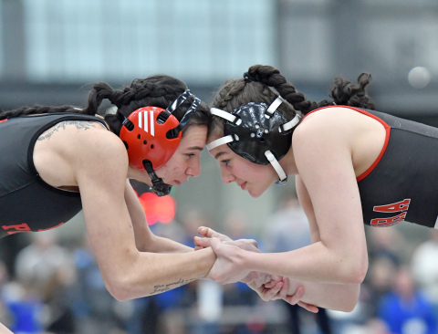 HPC's Dakota Gress (left) battles Aurora's Mia Leininger at Thursday's Norm Manstedt Invitational. 