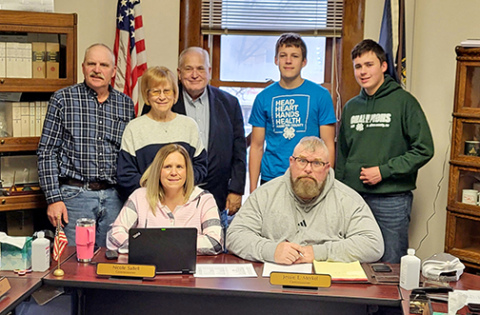 The Hamilton County Board of Commissions poses for a picture with two local 4-H club members following their proclamation Monday of February as 4-H Month. Seat from left are commissioners Nicole Sabell and Jessie Merkel. Standing are commissioners Francis McDonald, Nancy Salmon, Rich Nelson and 4-H members Boaz and Gideon Ochsner. 