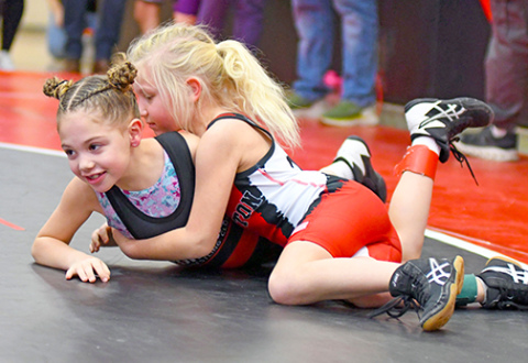 Avery McCarthy ponders a way to get out from under her Sutton opponent. 