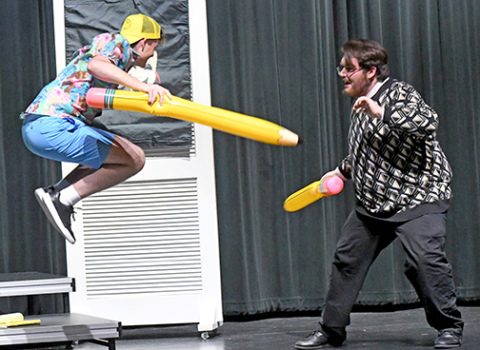 The Comedic Playwright, played by Trent Stevens (left) and the Tragic Playwright (Scott Bennett) dual with pencils as they fight for control over “Hydrangea Albright: Comedy or Tragedy?” 