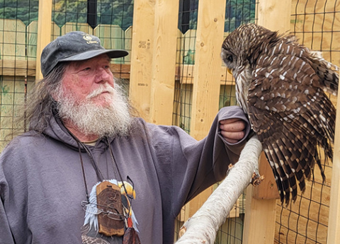 Raptor rescuer Tommy White with one of two birds he brought to the Edgerton this week