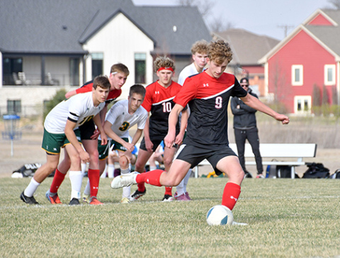 Aurora’s Alex Dick scored twice on penalty kicks to lift the Huskies in a 2-1 win over Kearney Catholic. 