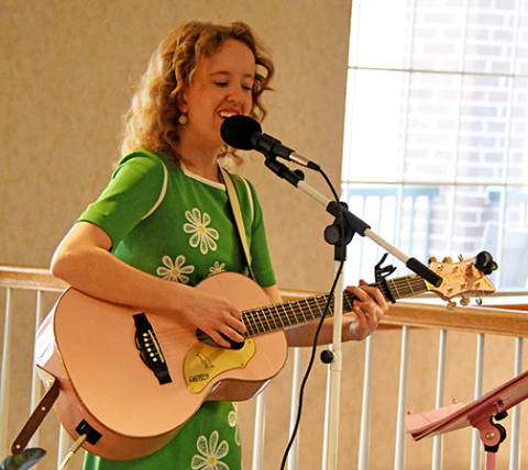 East Park Villa housekeeper Maddy (Barnes) Baker performs for residents at East Park Villa during the grand opening of The Grille on Friday, March 27. Baker has showcased her musical talents around the area, often performing songs from the 50s and 60s.
