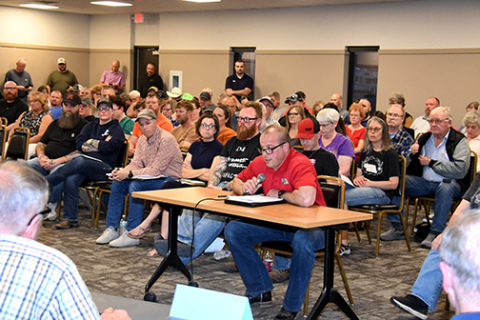 A crowd estimated at 150 people attended Tuesday’s Aurora City Council meeting. Pictured here, Gary Bruns of Lincoln spoke on behalf of the Nebraska Professional Firefighters Association union, urging the council not to solicit bids from private EMS companies. Several people spoke both for and against the proposal.